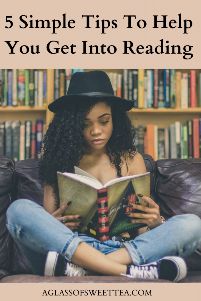 A curly-haired, brown-skinned woman wearing a black hat sits cross-legged on a leather sofa reading a book. The is a wall of books behind her. An Article: Tips tto Help You Get Into Reading. 